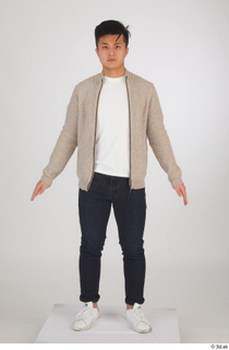 Yoshinaga Kuri blue jeans brown sweater casual dressed standing white…